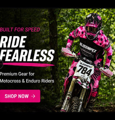 A mobile web page for Bliss Impex custom motorcycle gear, featuring a rider in pink and black patterned apparel on a dirt bike in a forest, with sections for jerseys, pants, helmets, and custom gear customization.